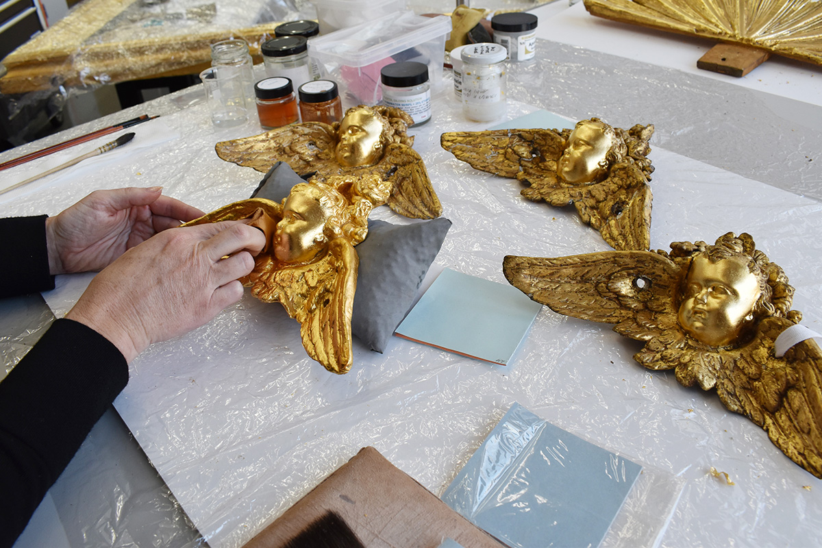 Rosie Heysen gilding existing cherub elements