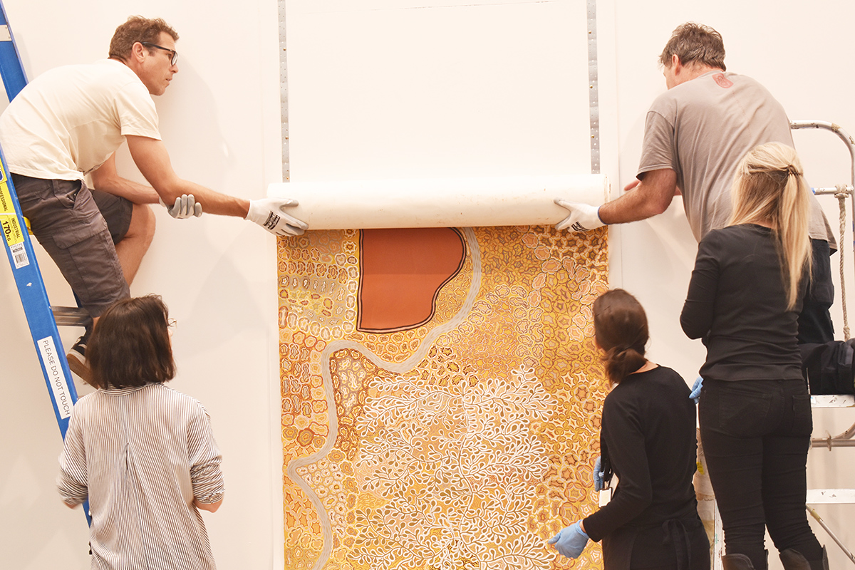 Installation of Standing on Country, Peggy Griffiths-Madij, Tarnanthi 2019, Art Gallery of South Australia, Adelaide with Artlab Paper Conservators and Art Gallery installation team. Image: Artlab Australia.