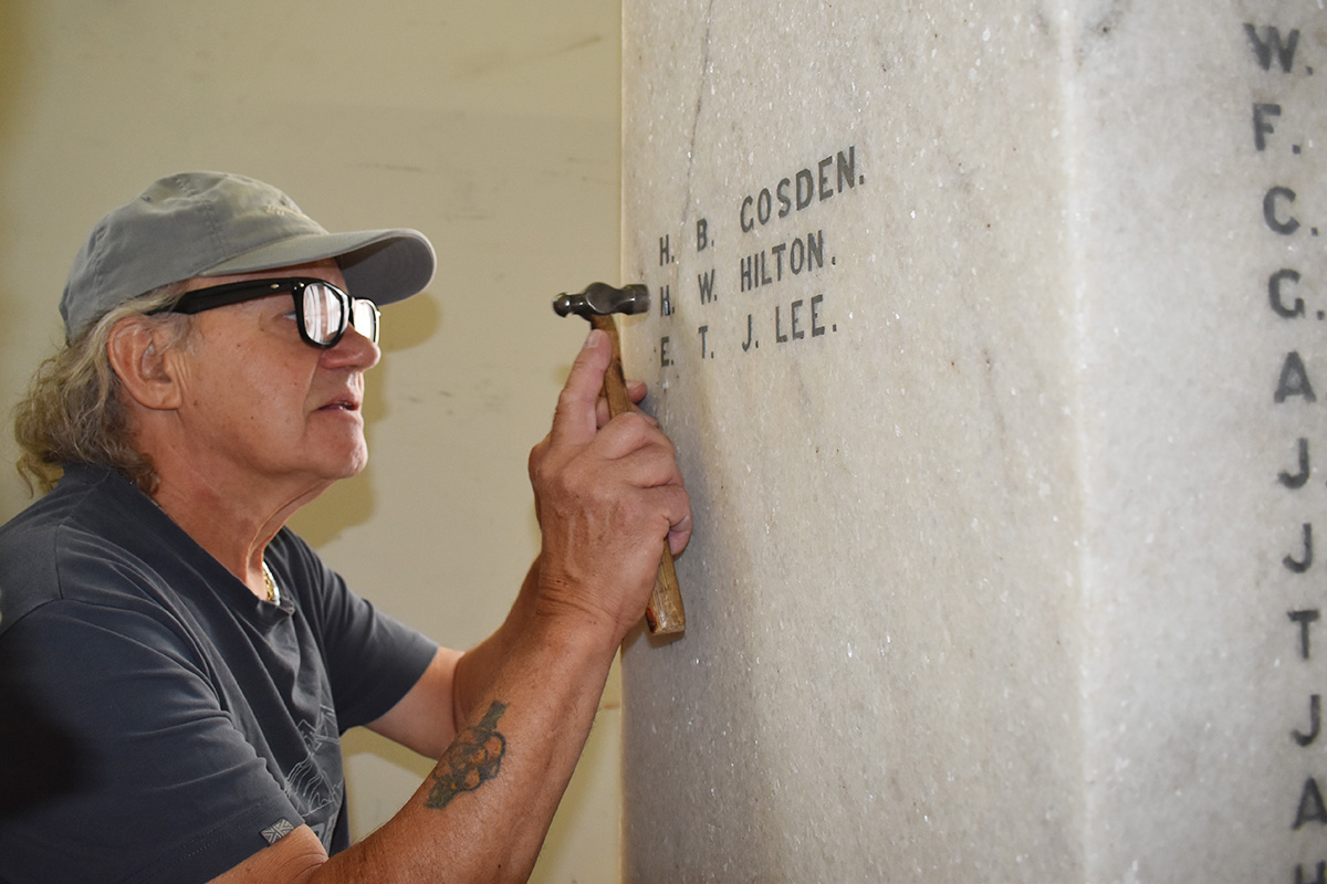 Fixing damaged lettering on memorial