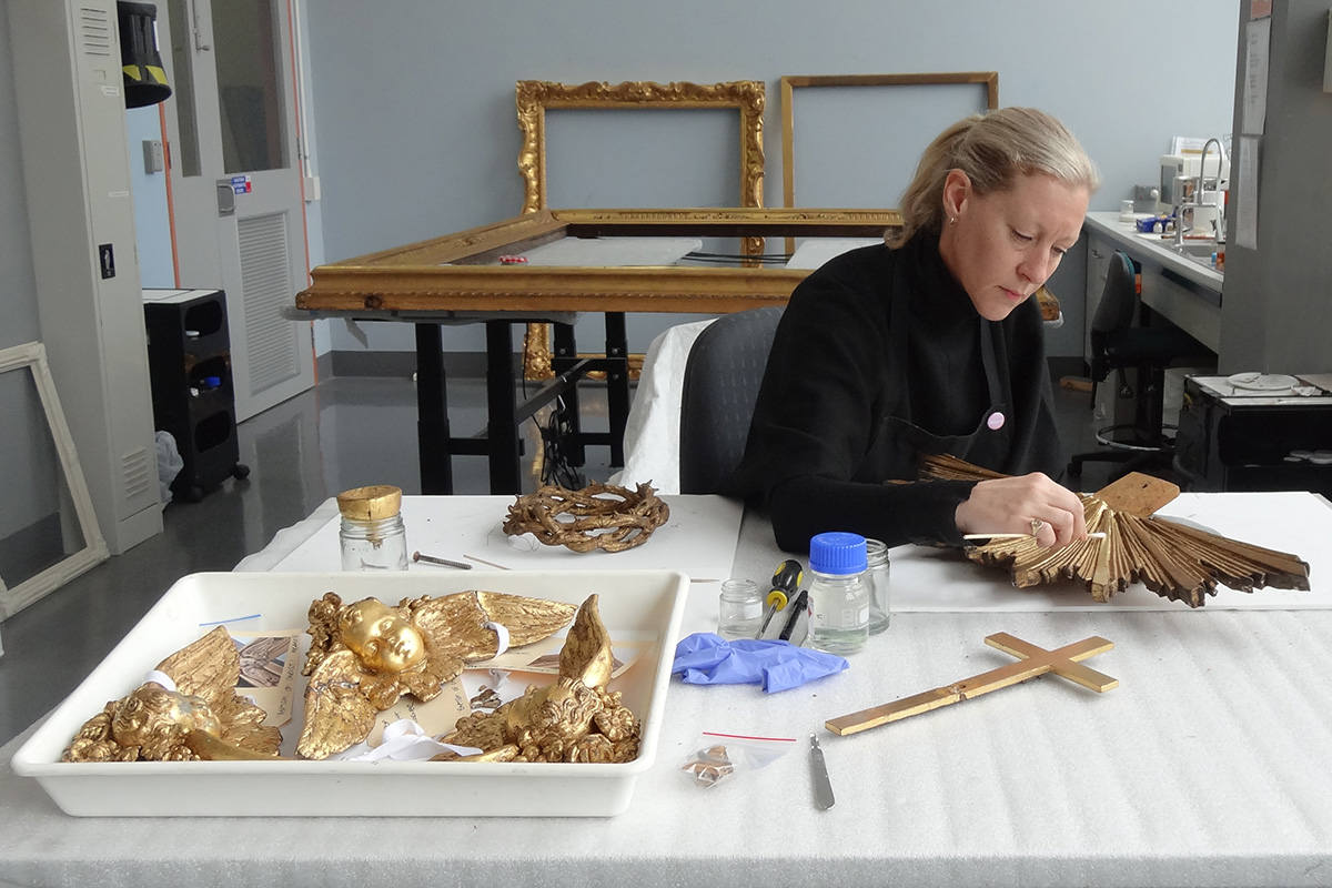 Conservator cleaning frame.
