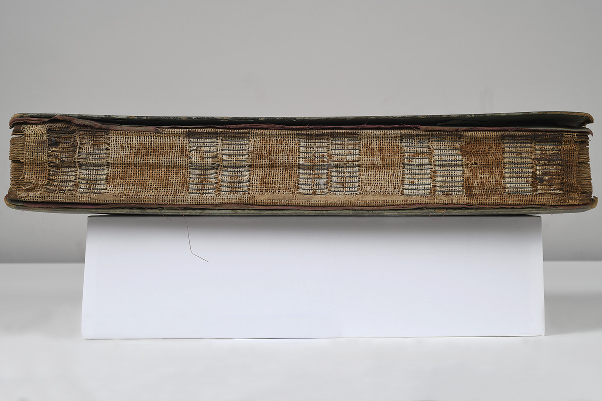 Damaged binding on postcard album