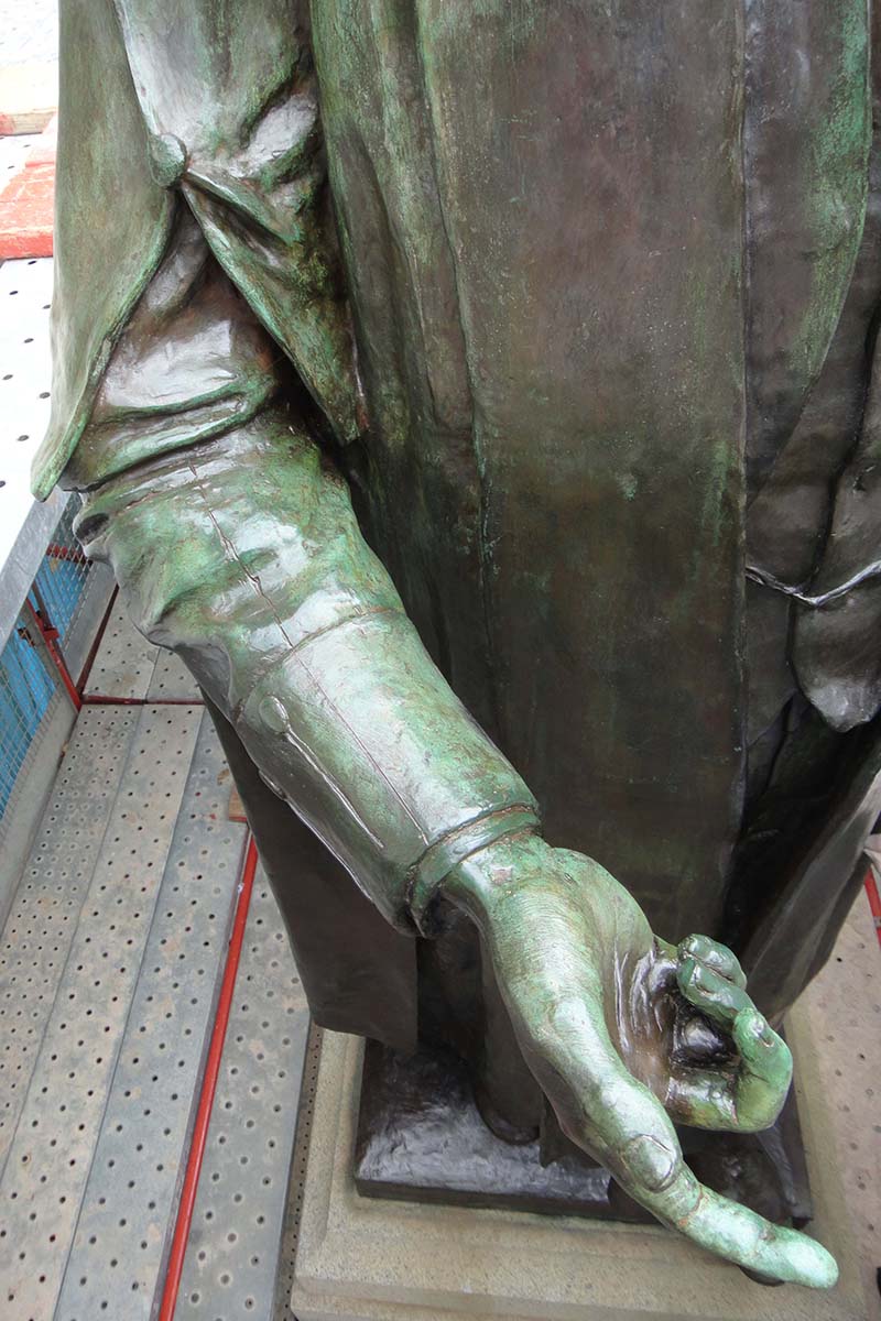 Detail of torso of memorial after conservation treatment