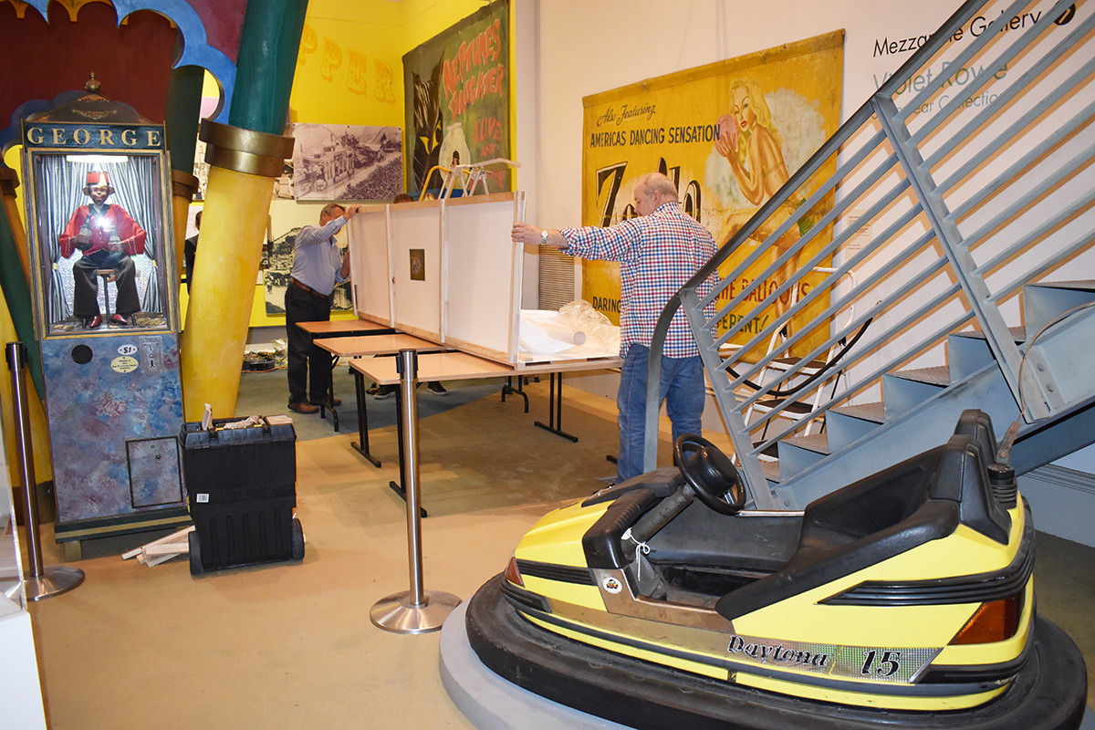 Conservators working on banner